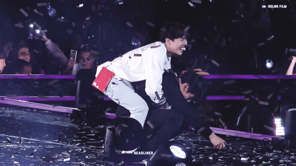 BTS performing at Wembley Stadium in front of a cheering crowd